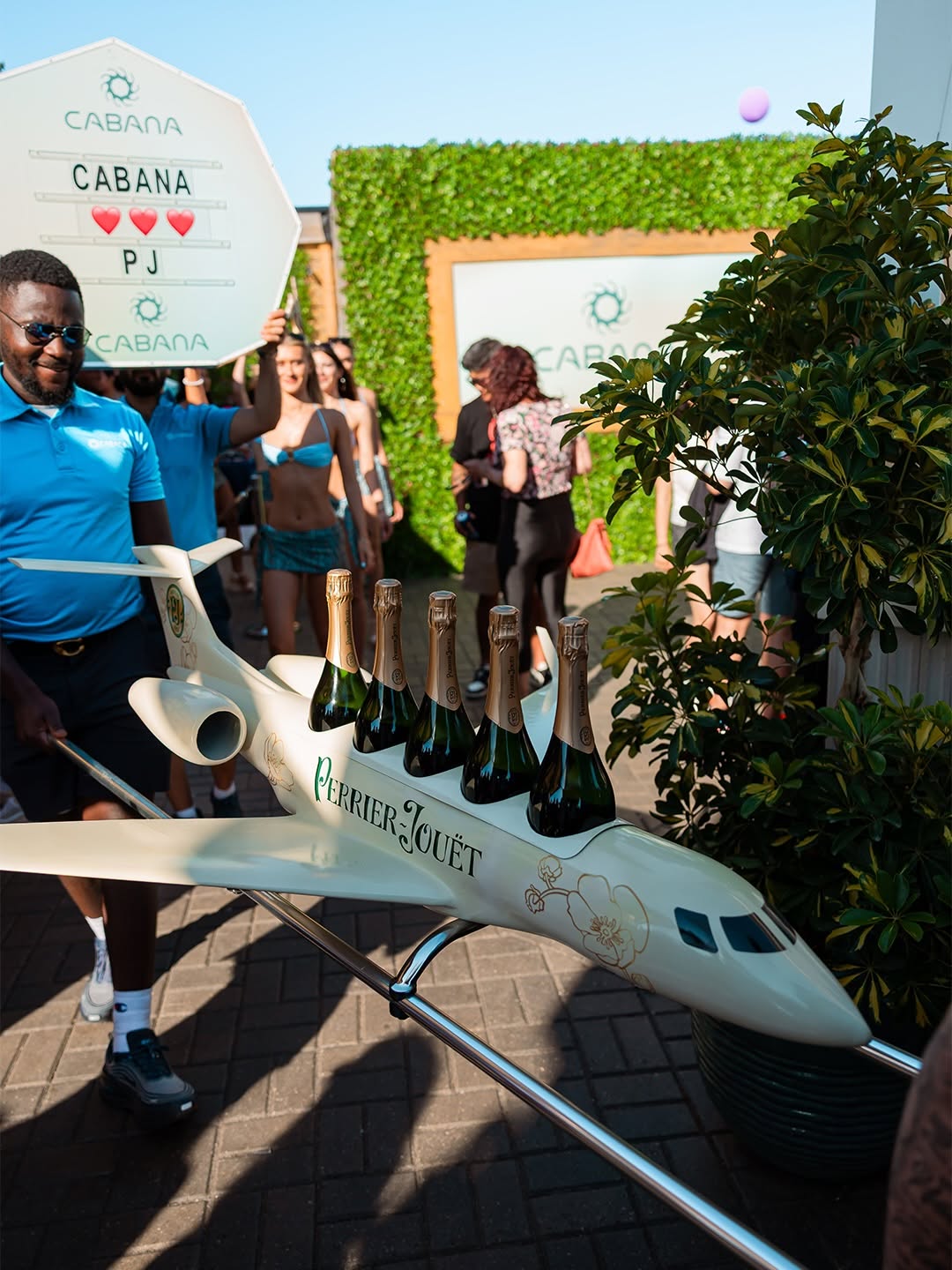 Perrier-Jouët custom 6 ft private jet prop LED bottle glorifier built by Drip Entertainment for Rebel Nightclub Cabana Pool Bar and DPRTMNT Toronto